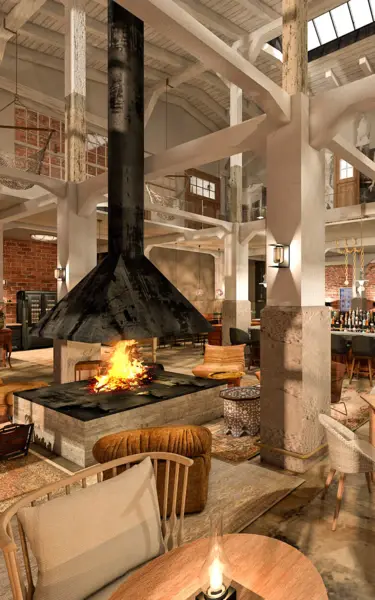 Una sala con tavoli, sedie e camino.