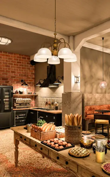 Cucina con tavolo pieno di cibo.